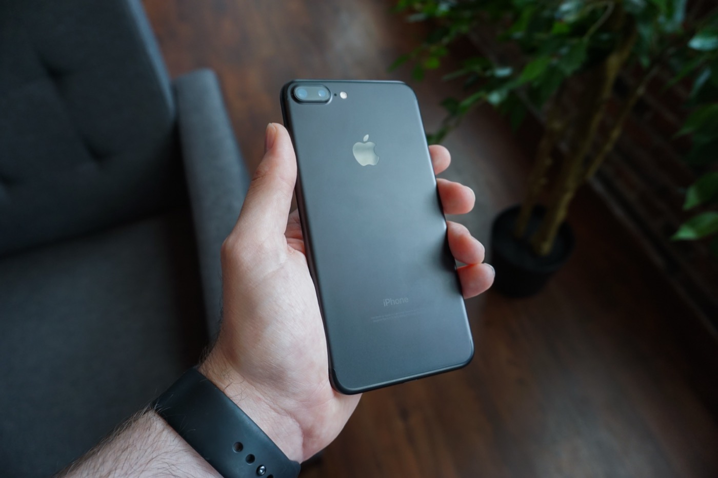 Smartphone held in hand for visual AI verification