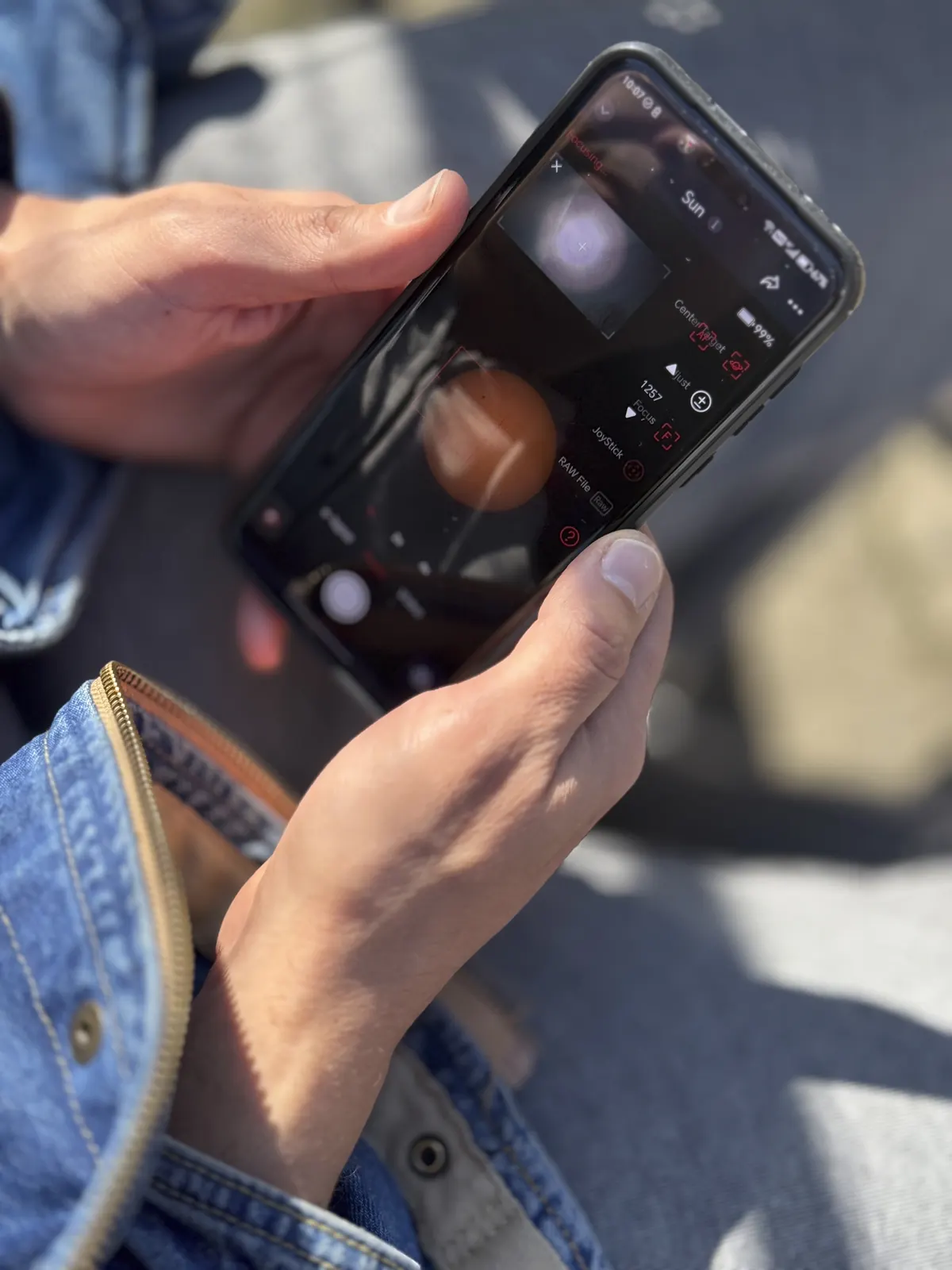 A smartphone camera being used as a visual search tool outdoors